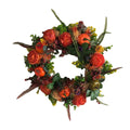 Fall wreath with orange pumpkins, peony-style flowers and berries on a white background