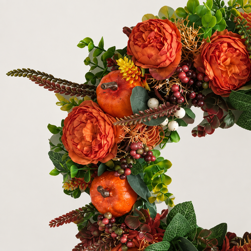 Close-up illustration of orange flowers, pumpkins and berries on the fall wreath