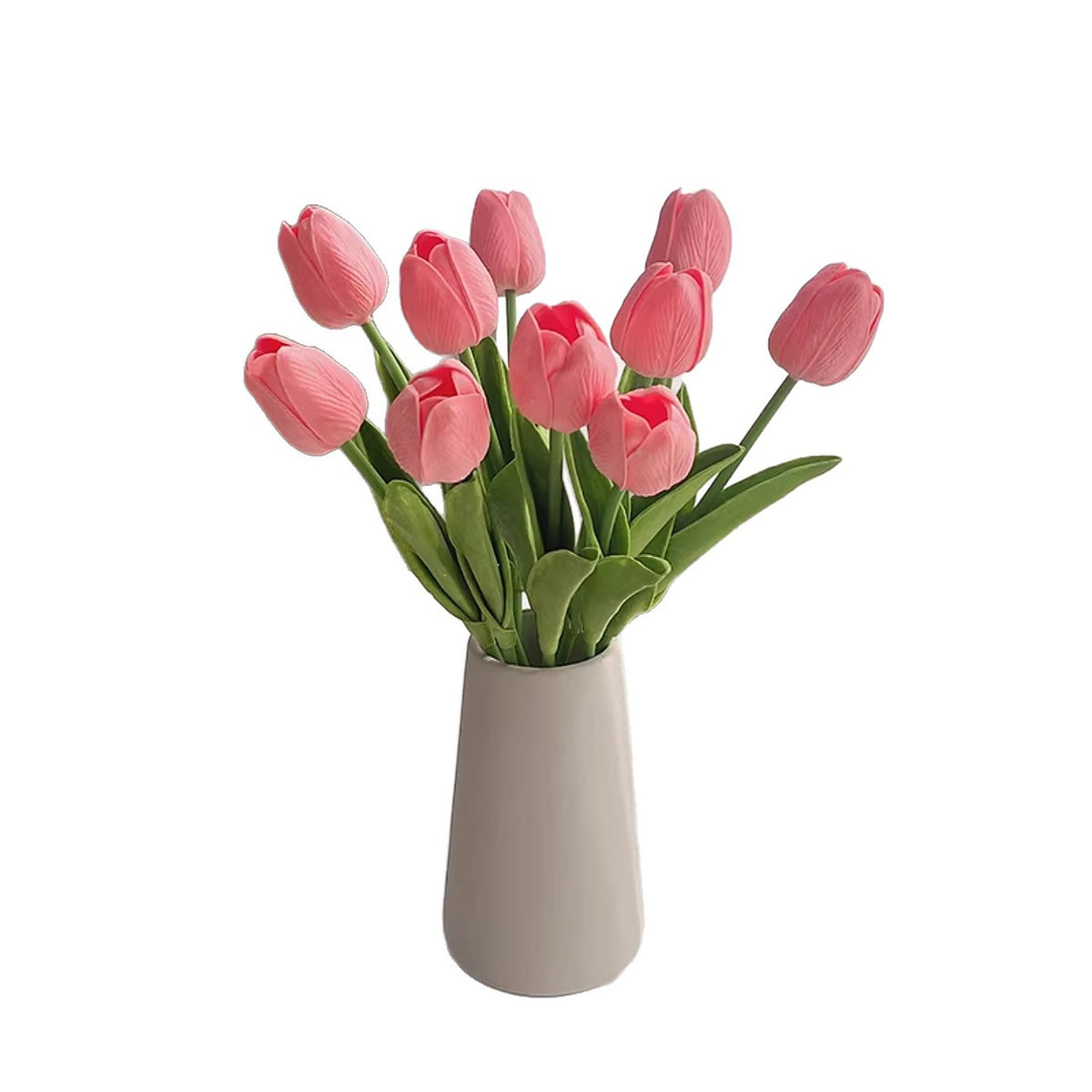 Pink faux tulip bouquet arranged in a vase on a white background
